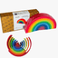 Set of colorful wooden rainbow toys with packaging on a white background